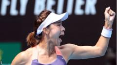 Wang Qiang celebrates beating Serena Williams at the Australoan Open