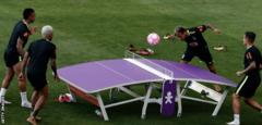 Brazil's Gabriel Jesus (L) Dani Alves (2nd L), Neymar and Philippe Coutinho (R) play a game of teqball