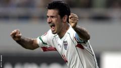Ali Daei celebrates scoring for Iran
