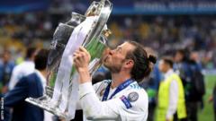 Gareth Bale kisses the trophy