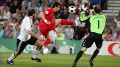 Portugal's Helder Postiga lunges for the ball against Germany at Euro 2008