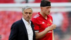 Jose Mourinho and Phil Jones