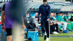 Kylian Mbappe on crutches