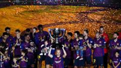 Andres Iniesta lifts the La Liga trophy