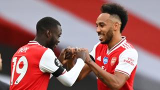 Pierre-Emerick Aubameyang (right) celebrates as Arsenal beat Norwich City 4-0