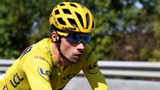 Primoz Roglic racing on stage 15
