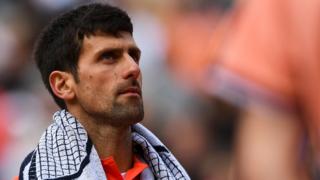 Djokovic looks to the sky