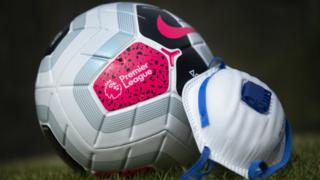 Premier League football and mask