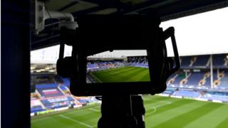 Goodison Park and a television camera for a premier league match