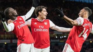 Pierre-Emerick Aubameyang (right) celebrates with Arsenal team-mates