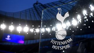 The Tottenham badge on the home dugout before a Champions League match