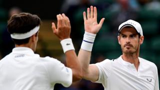 Andy Murray high fives Pierre-Hugues Herbert