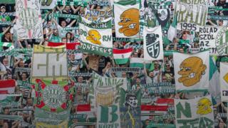 Ferencvaros fans display banners supporting their club