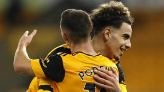 Rayan Ait-Nouri celebrates with team-mate Daniel Podence