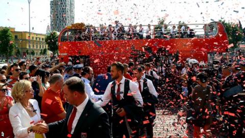 A tickertape welcome for the Albanian team