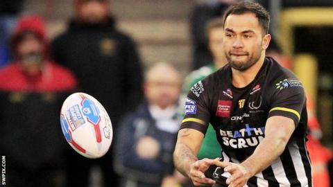 Aaron Heremaia passes the ball
