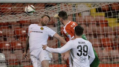 Action from Cliftonville against Carrick Rangers at Solitude
