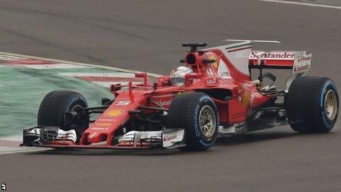 Sebastian Vettel steers the new Ferrari SF70H in Maranello, Italy