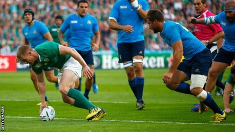 Keith Earls of Ireland scores their first try during the 2015 Rugby World Cup Pool D match between Ireland and Italy at the Olympic Stadium