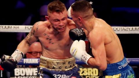 Warrington retained his IBF featherweight world title with an emphatic win over Frampton in Manchester