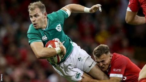 Will Addison is tackled by Wales' Jarrod Evans