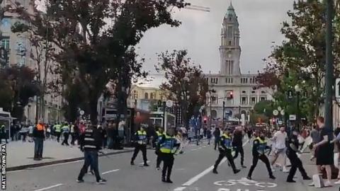 England fans clashed with police in Porto in a fan zone as supporters watched Portugal play Switzerland