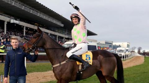 Patrick Mullins celebrates his Ryanair Hurdle win onboard Sharjah
