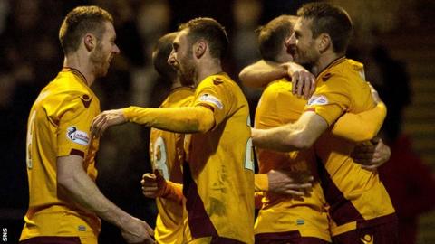 Motherwell celebrate a late goal by Stephen Pearson (left)