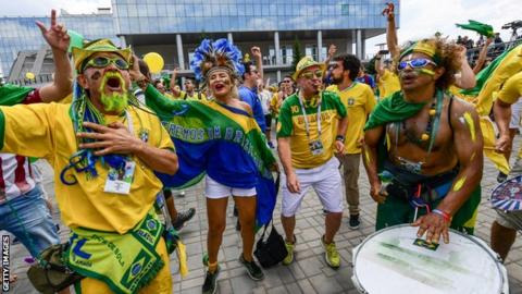 Brazilian fans party outside the hotel the Brazil team are occupying in Kazan