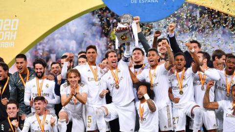 Real Madrid players celebrate beating Atletico Madrid in the Spanish Super Cup final