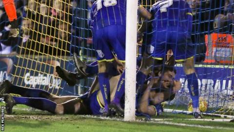 Paul Robinson scores for AFC Wimbledon against Carlisle