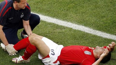 Michael Owen after tearing his anterior cruciate ligament on England duty in 2006
