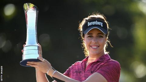 Georgia Hall holding the British Open trophy