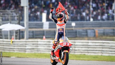 Marc Marquez celebrates winning the MotoGP world title
