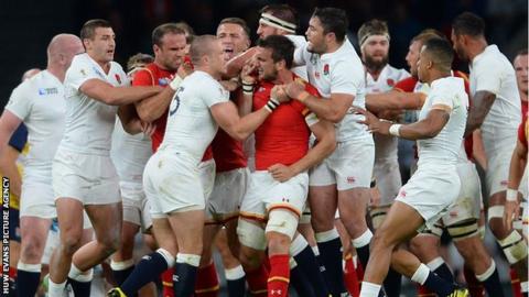 England full-back Mike Brown and Wales captain Sam Warburton scuffle during the World Cup game at twickenham
