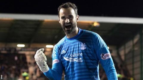 Joe Lewis celebrates beating Hibs in a quarter-final penalty shootout