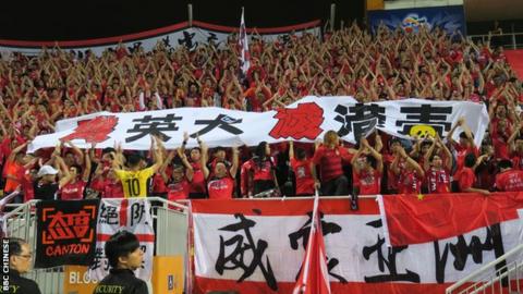Guangzhou Evergrande fans show a banner that reads "Annihilate British dogs, extinguish HK independence poison" during the match at the Mong Kok Stadium in Hong Kong, 25 Apr 2017.