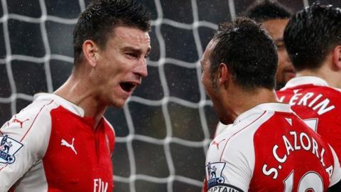 Laurent Koscielny and Santi Cazorla of Arsenal