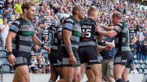 Hull celebrate the last of their six tries against reigning Super League champions