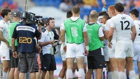 Great Britain head coach Simon Amor speaks to his team