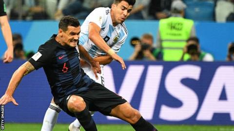 Dejan Lovren (left) makes a tackle