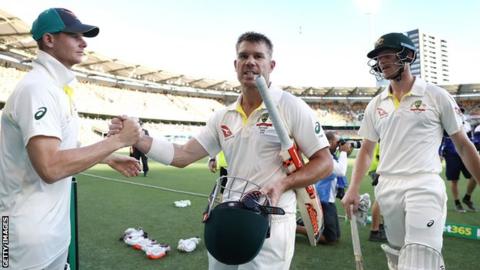 Steve Smith of Australia congratulates David Warner and Cameron Bancroft as they walk from the ground at the end of day four of the first Test of the 2017/18 Ashes Series between Australia and England.