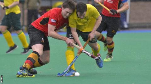 Banbridge's Ross Beattie battles for possession with Railway Union opponent James Dick