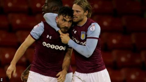 Aston Villa's Birkir Bjarnason hugs Aston Villa's Robert Snodgrass after he scores the winner