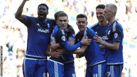 Stuart O'Keefe celebrates with his Cardiff team-mates after his winner against Derby