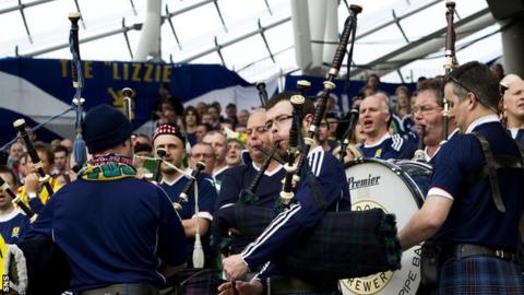 Bagpipers at a Scotland match