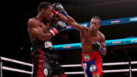 American boxer Patrick Day (right) throws a punch during his fight against Charles Conwell (left)