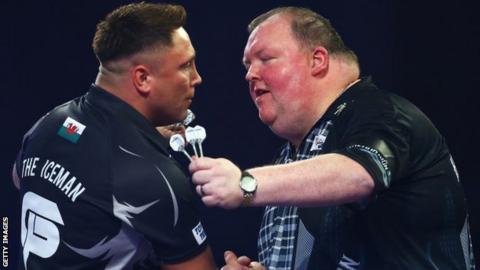 John Henderson (right) congratulates Gerwyn Price after his 4-0 defeat