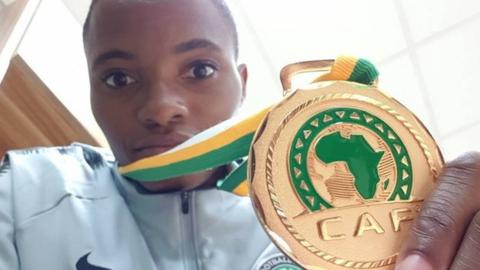 Nigeria's Rasheedat Ajibade with her Women's Africa Cup of Nations medal