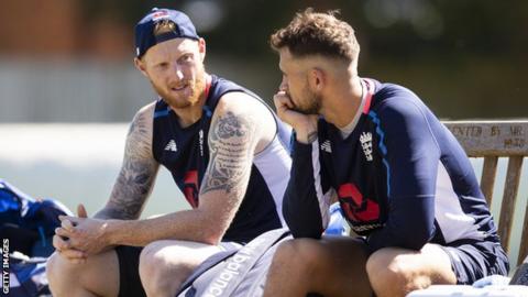 England cricketers Ben Stokes (left) and Alex Hales (right) talk while sat on a bench during a break in practice